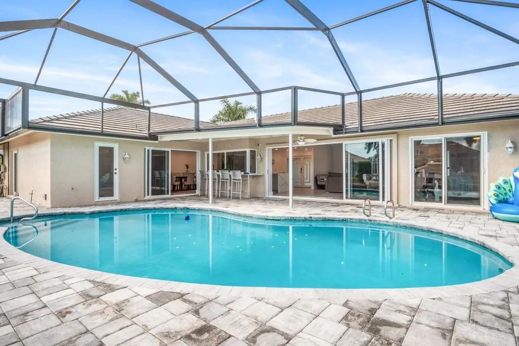 Private heated pool and screened lanai at a Marco Island vacation rental